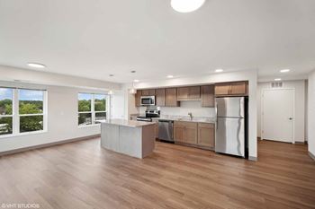a kitchen with a large island in the middle of it